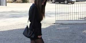 Beitragsbild des Blogbeitrags black playsuit, featuring tie sleeves, a tie waist and long sleeves. 