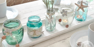 Beitragsbild des Blogbeitrags Maritime Windlichter aus Altglas selber machen