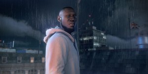 Beitragsbild des Blogbeitrags Watch Dogs: Legion – Der britische Musiker Stormzy und Aiden Pearce sind im Spiel dabei