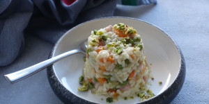 Beitragsbild des Blogbeitrags „Riso in forma“ mit Mortadella & Pistazien