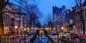 Beitragsbild des Blogbeitrags Amsterdam: The Liberal City Of Bikes, Coffeeshops, and Canals 
