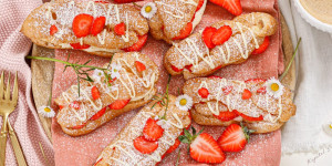 Beitragsbild des Blogbeitrags SÜSSE ZAUBERSTANGERL WIE AUS FRANKREICH! Erdbeer Éclairs mit weißer Schokoladencreme 