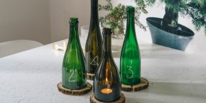 Beitragsbild des Blogbeitrags DIY Adventskranz aus alten Glasflaschen 