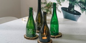 Beitragsbild des Blogbeitrags DIY Adventskranz aus alten Glasflaschen